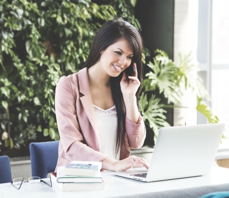 Woman Being Helped by Financial Advisors on the Phone with Computer