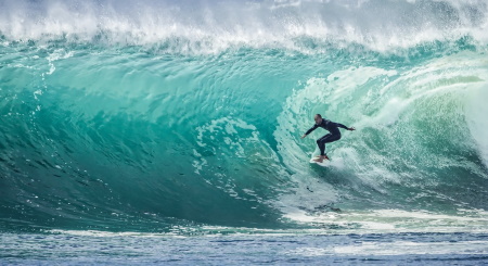 Man Surfing Representing Expert Stock Investing